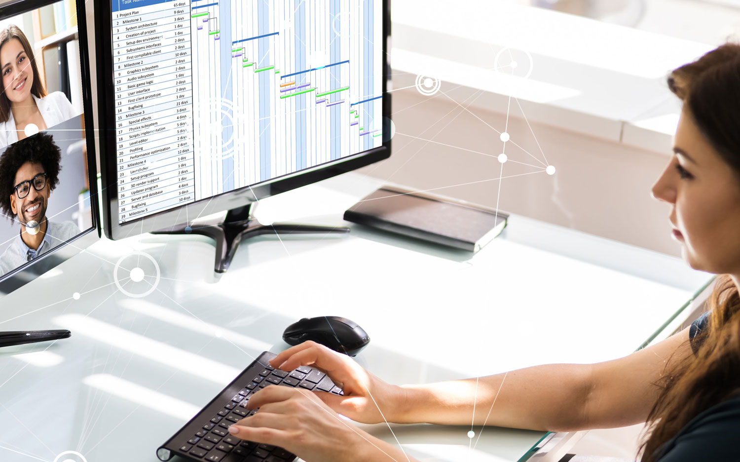 woman at a computer on a video call and looking at a spreadsheet