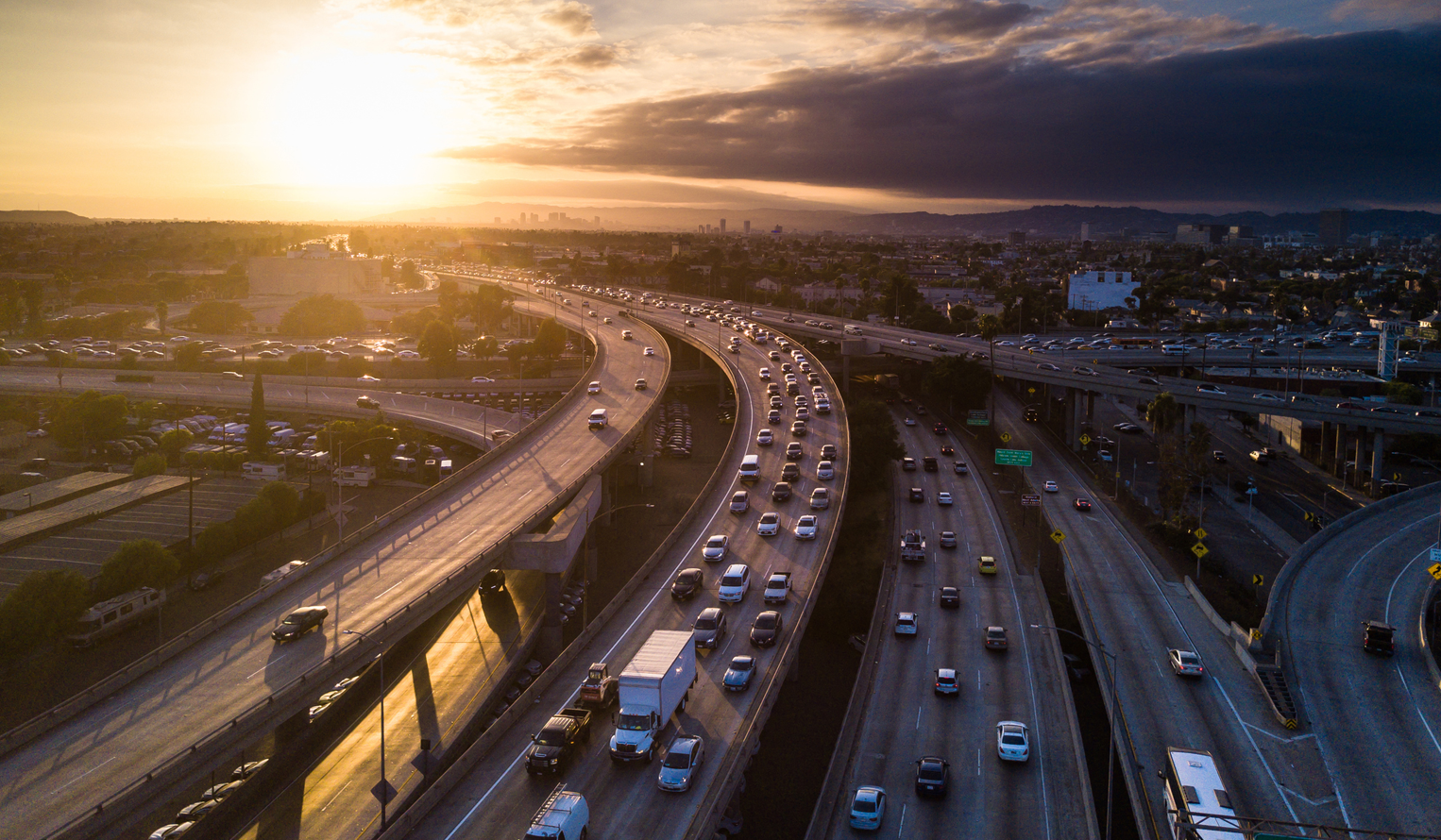 view of a busy Los Angeles highway system at sunset