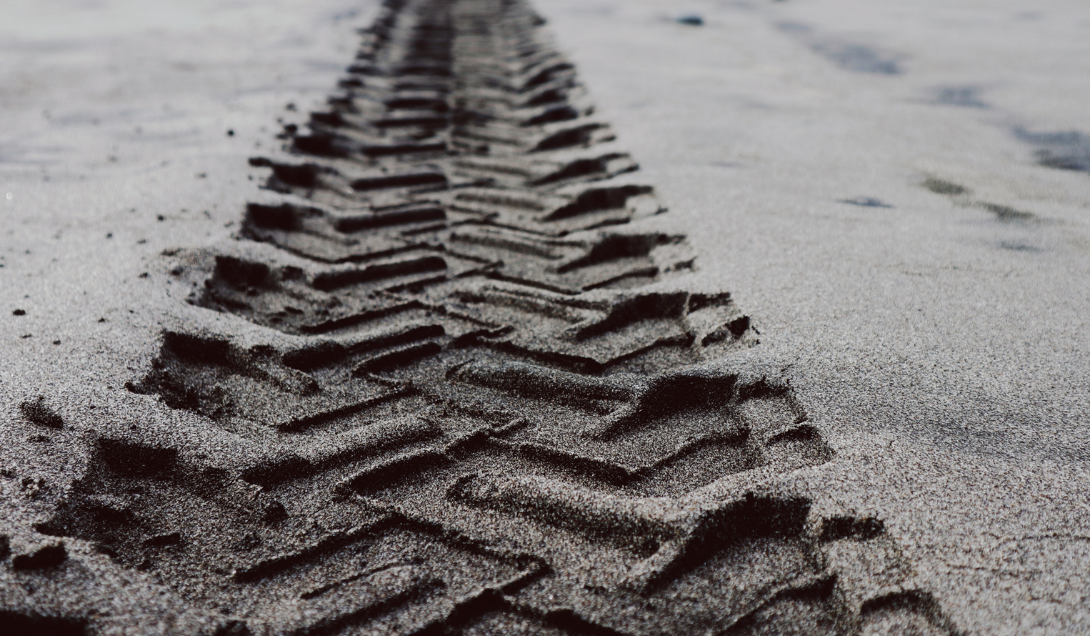 close up of a tire track in the dirt