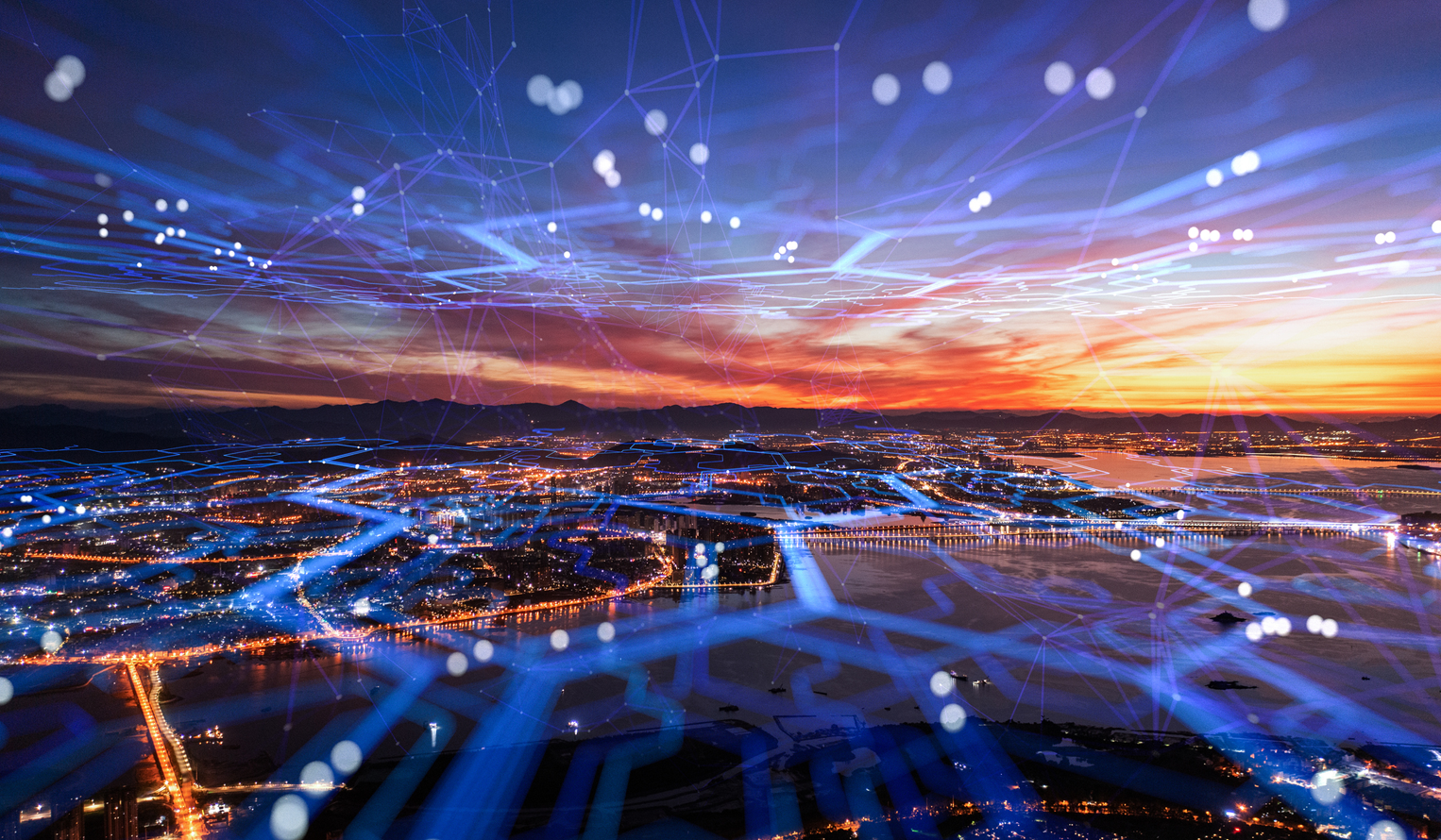 a city at night horizon with an overlaid network graphic