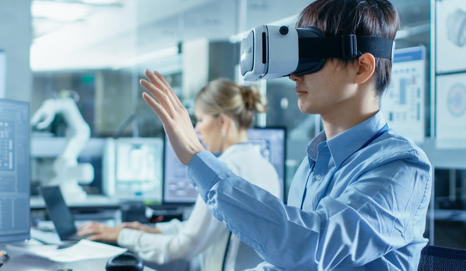 a young man wearing extended reality glass during a lab training