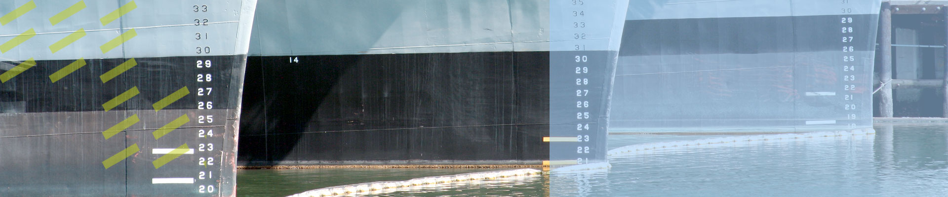 backround image of three navy ship hulls docked in a row