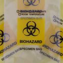 plastic specimen bags with black and yellow biohazard logo