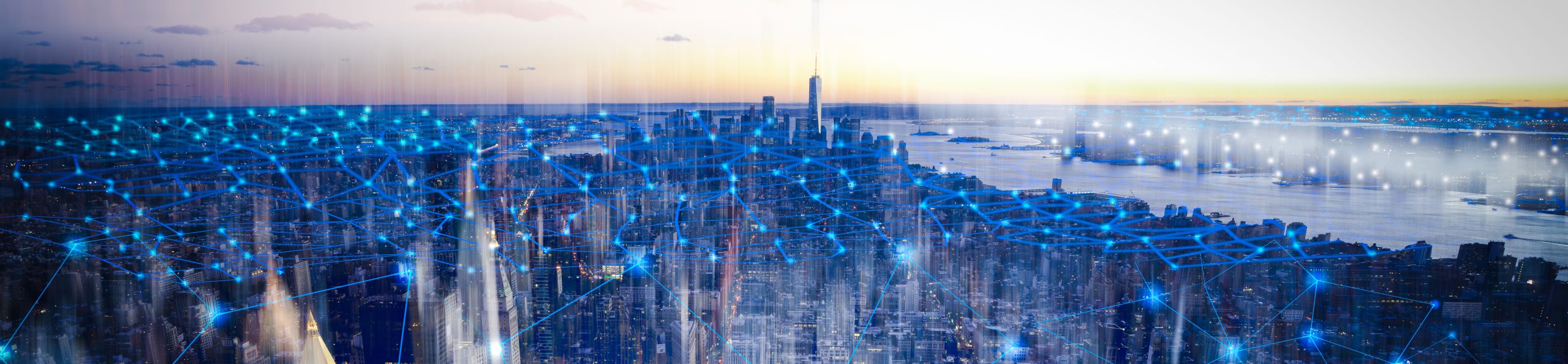 aerial view of a city and horizon at night with network connection lines overlaid