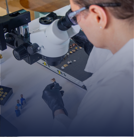 woman looking through a microscope