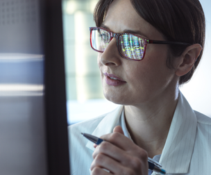 woman looking at computer screen