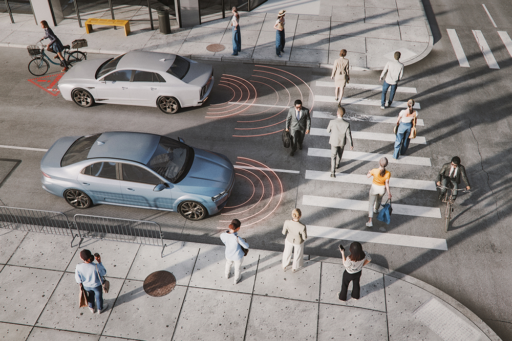 aerial view of road with smart cars detecting people walking in front of them