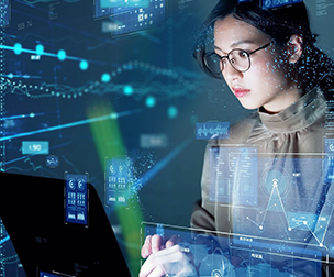 woman looking at data and software on laptop