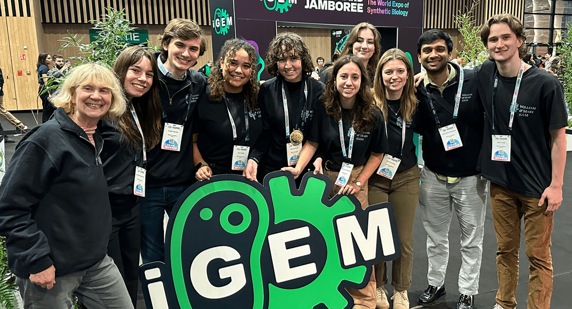 Noblis staff at iGem with iGem sign