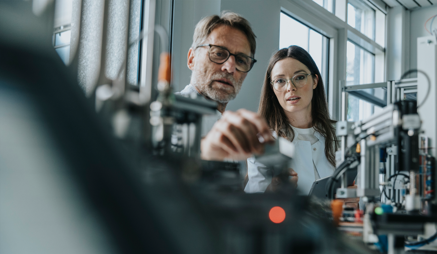 two researchers building a technology project
