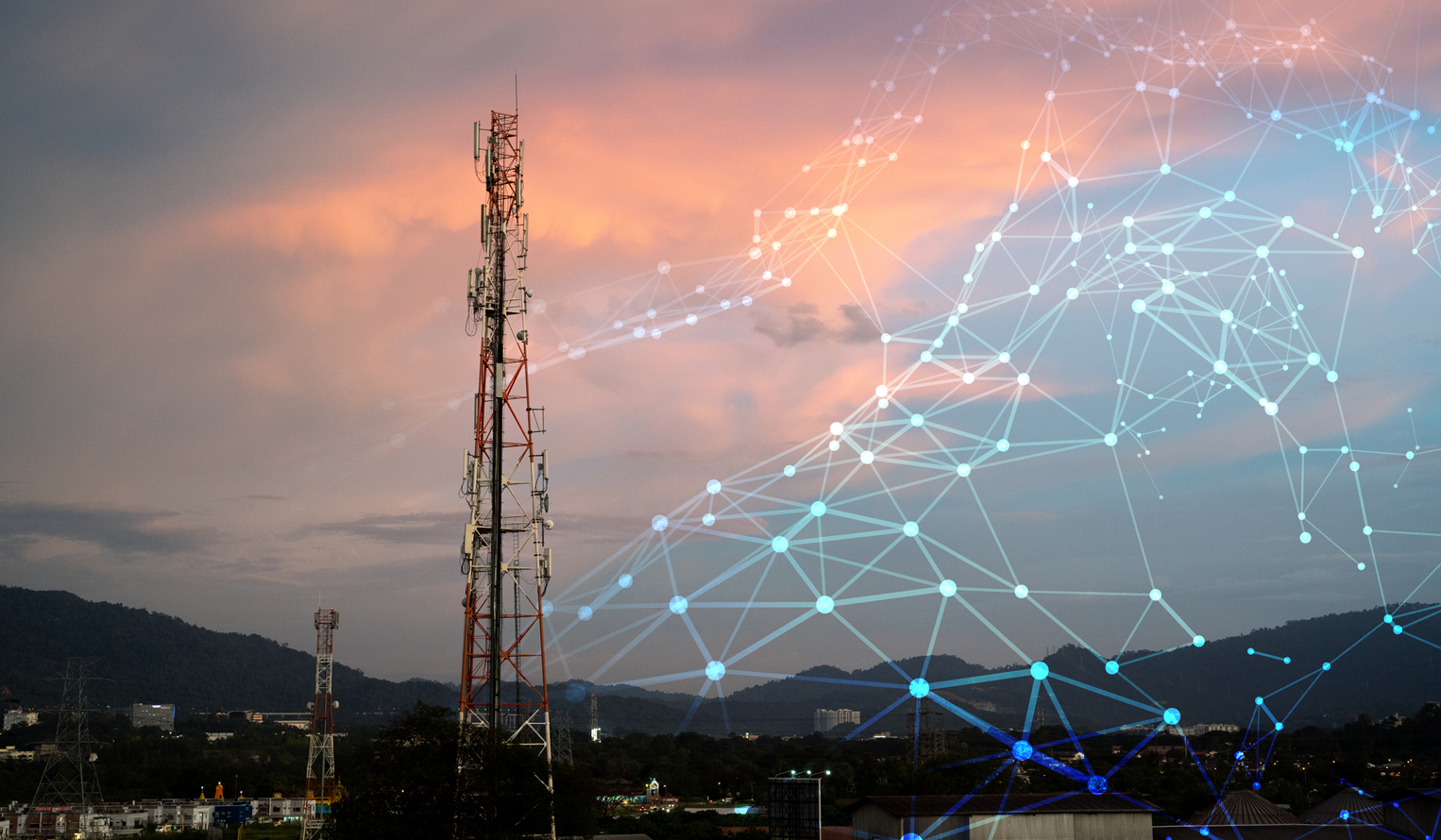 a mobile communications tower at sunset