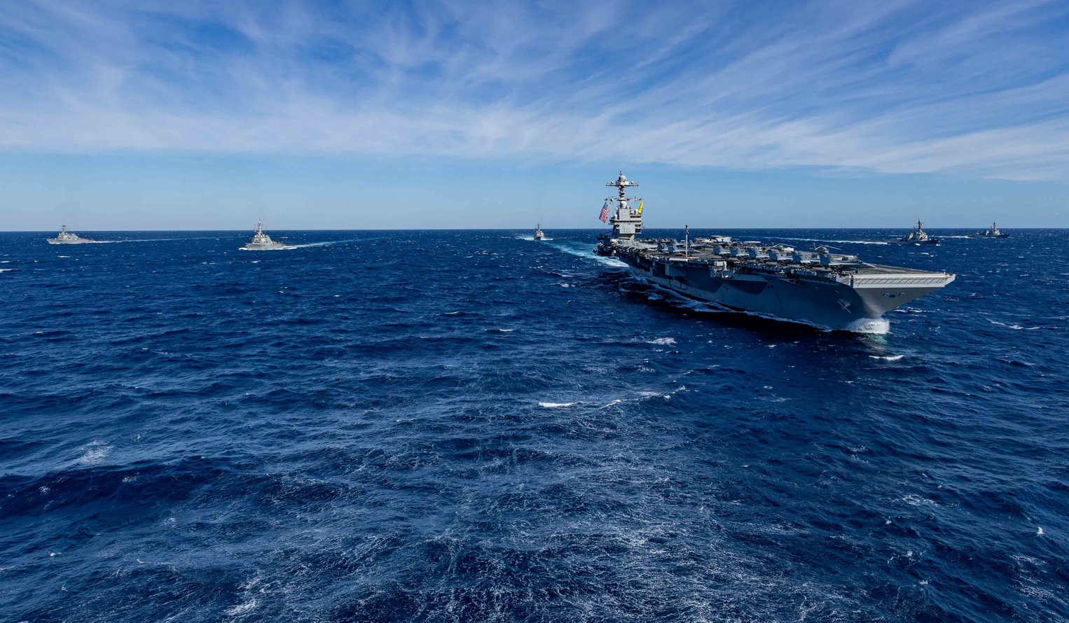 Aircraft carrier, USS Gerald R. Ford (CVN 78), sails in formation in the Pacific ocean.